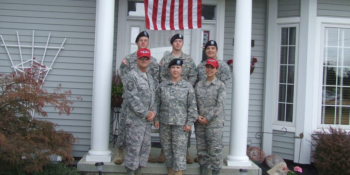 Members of the Clemens Family, with more than 120 years of military service, stand in front of the Family home in Port Clinton after three of them returned from overseas deployments.